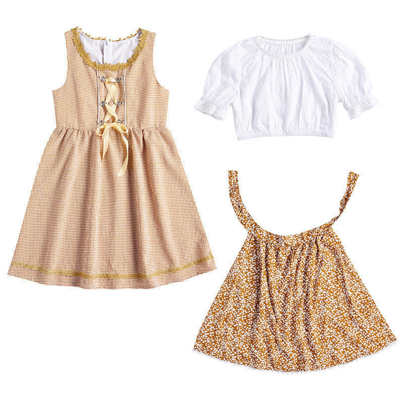 Traditionelles Kleid für Mädchen mit Schürze und Bluse mit Puffärmeln