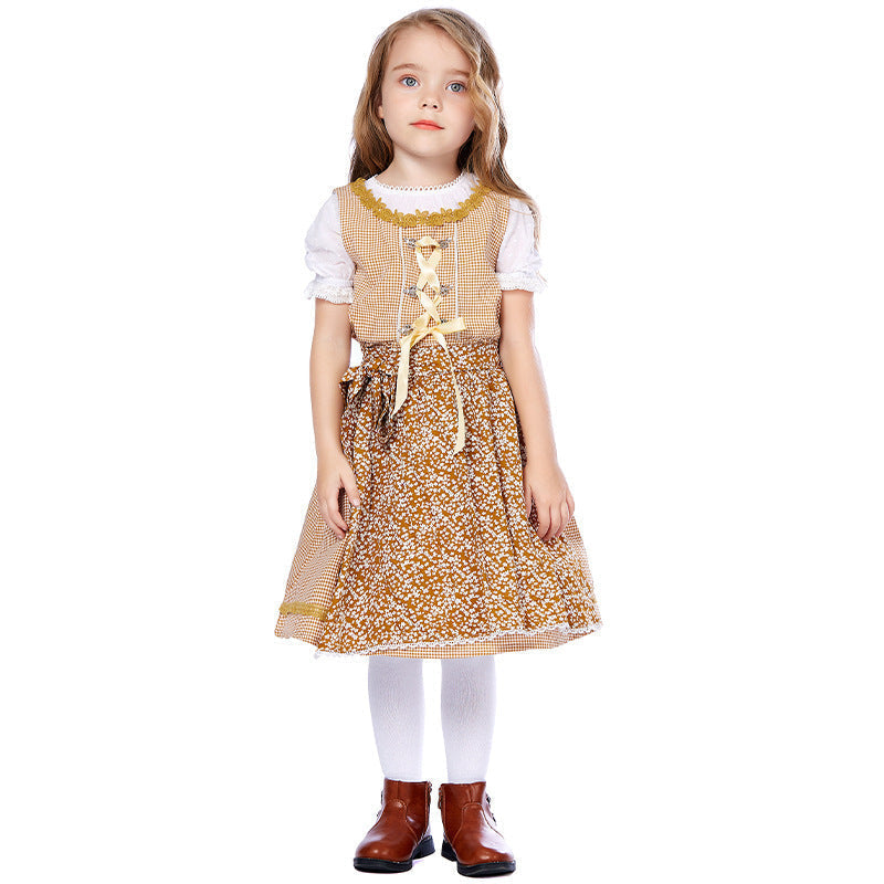 Traditionelles Kleid für Mädchen mit Schürze und Bluse mit Puffärmeln